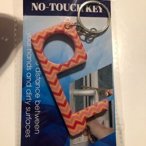 New! No touch key Pink and Yellow Conveniently attaches to your key ring